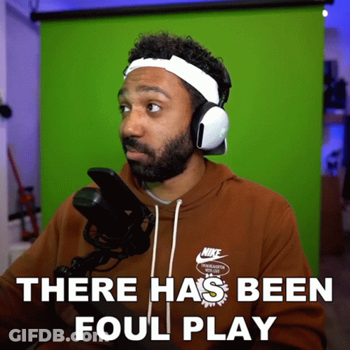 Man In Nike Sweatshirt And Headphones Says There Has Been Foul Play GIF