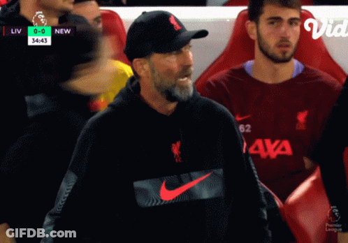 Man In Nike Sweatshirt Sitting In Soccer Stands GIF