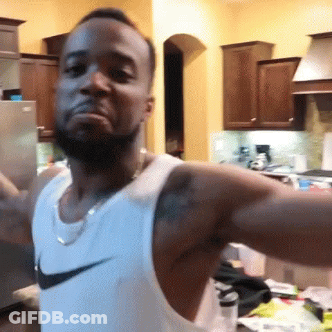 Man In Nike Tank Top Arms Outstretched GIF