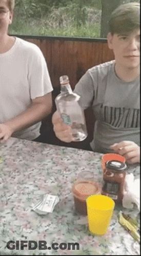Man In Nirvana Shirt Holding Bottle GIF