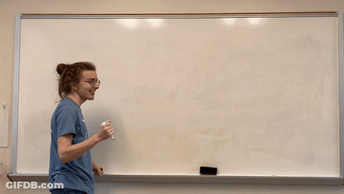 Man In Northwest Vista College Wildcats Shirt Writing On Whiteboard GIF