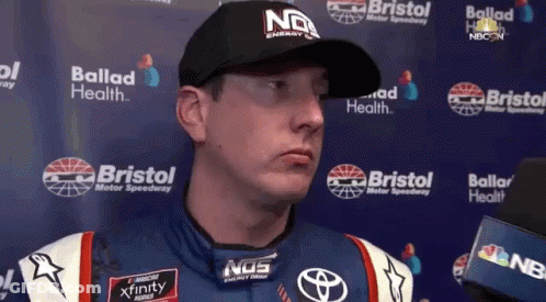 Man In NOS Hat Talking To Reporter GIF