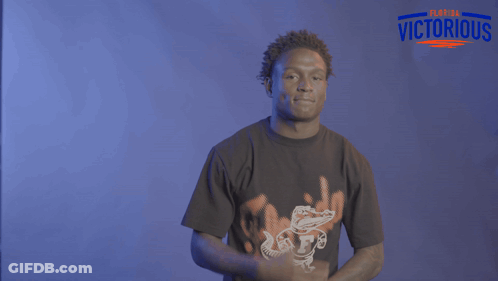 Man In Number 1 Jersey In Front Of Crowd GIF