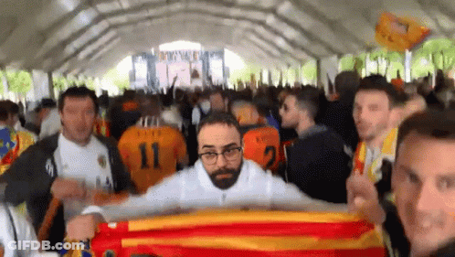 Man In Number 11 Jersey Holding Flag GIF