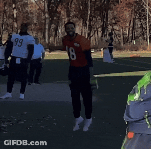 Man In Number 18 Jersey With Players GIF
