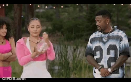 Man In Number 22 Jersey Beside Two Women GIF