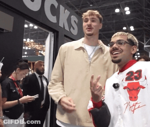 Man In Number 23 Jersey Next To Man With Glasses GIF