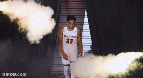 Man In Number 23 Jersey Walking Through Smoke GIF