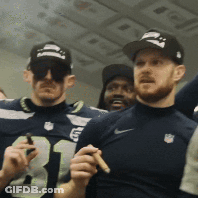 Man In Number 31 Jersey Holding Cigar GIF