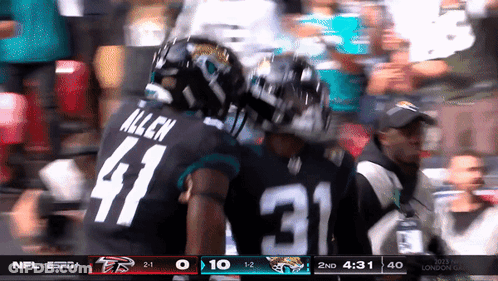 Man In Number 5 Jersey Dancing In Front Of Speaker Saying Come On Jaguars GIF