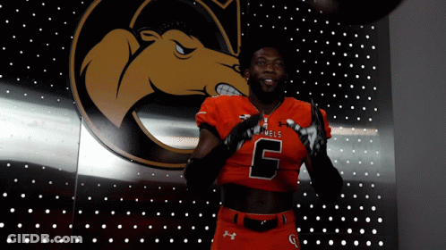 Man In Number 6 Jersey In Front Of Camel Logo GIF