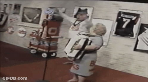 Man In Number 7 Jersey Next To Woman In Number 13 Dress GIF