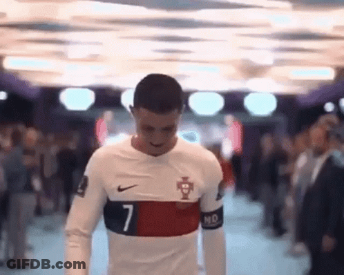 Man In Number 7 Soccer Jersey Walking Through Crowd GIF