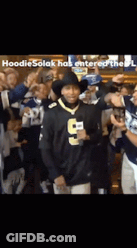 Man In Number 9 Jersey Surrounded By People GIF