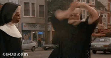 Man In Nun Costume Next To Nun On City Street GIF