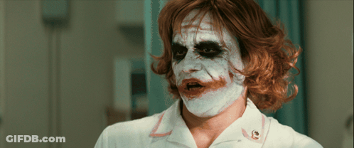 Man In Nurse Uniform With Joker Face Paint GIF