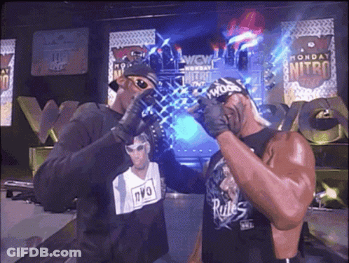 Man In NVO Shirt Standing Next To Another Man GIF