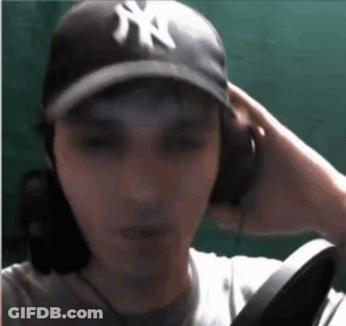 Man In NY Hat And Headphones GIF