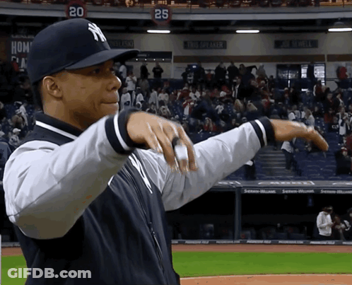 Man In NY Hat On Baseball Field With Crowd GIF