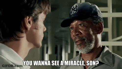Man In NY Hat Talking To Another Man GIF