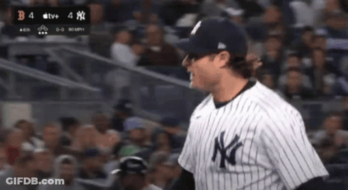 Man In NY Yankees Jersey Standing In Crowd GIF
