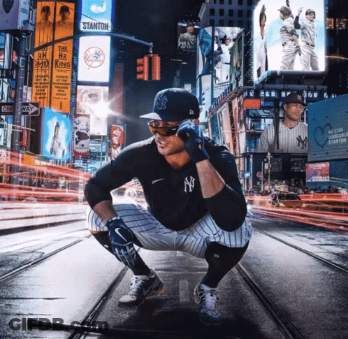 Man In NY Yankees Uniform Squatting With Bat GIF