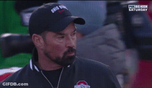 Man In Ohio State Hat In Front Of Football Player GIF