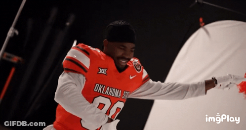Man In Oklahoma State Football Jersey Smiling GIF