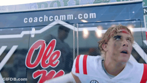 Man In Ole Miss Jersey In Front Of Coachcomm Truck GIF