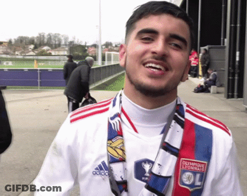 Man In Olympique Lyonnais Shirt And Scarf Smiling GIF