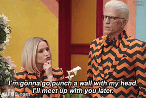 Man In Orange And Black Striped Suit With Woman GIF