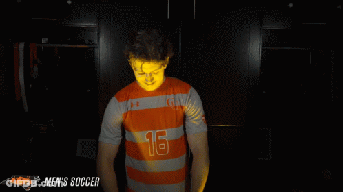 Man In Orange And Gray Striped Jersey Number 16 GIF