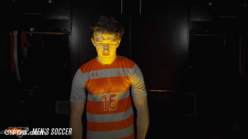 Man In Orange And Grey Striped Shirt Number 16 GIF