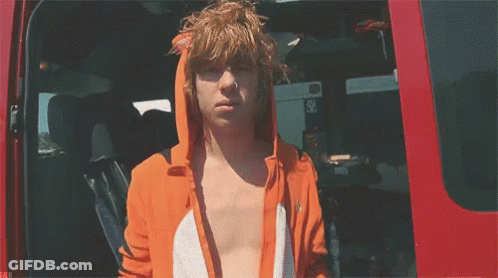Man In Orange Fox Hoodie Standing In Red Van GIF