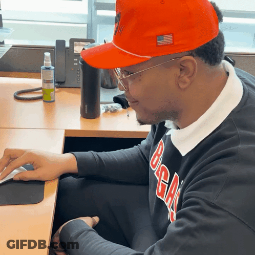 Man In Orange Hat And Black Sweater Saying BGA GIF