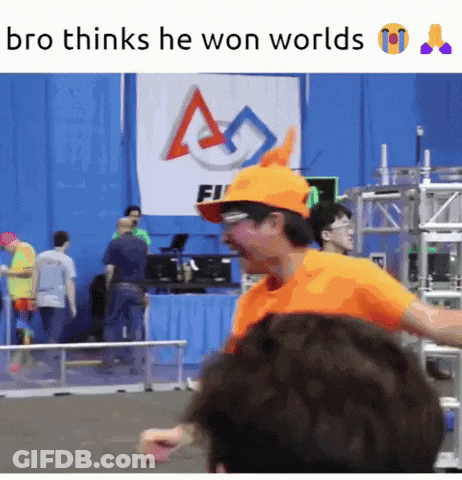 Man In Orange Hat And Glasses Standing In Front Of Sign Saying Fi GIF