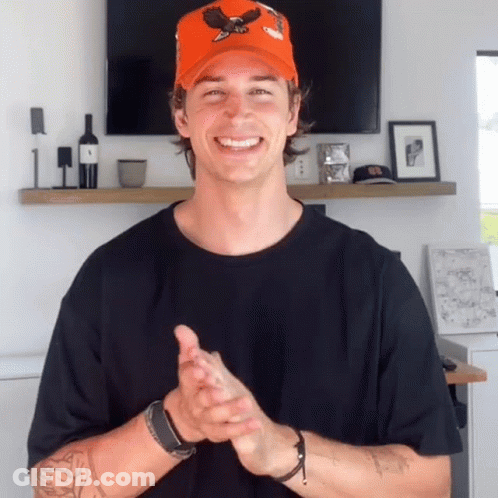 Man In Orange Hat With Eagle Clapping Hands GIF