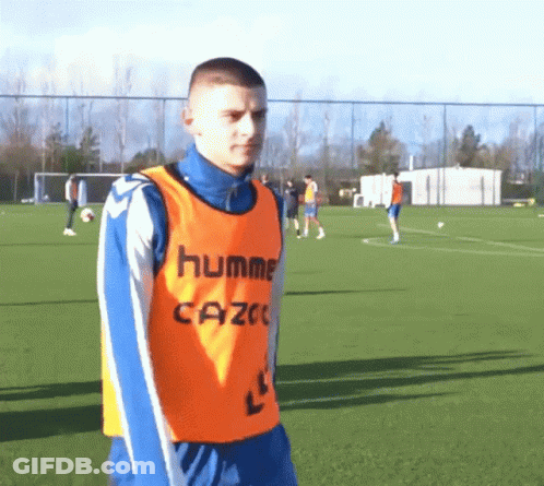 Man In Orange Hummel Cazoe Vest GIF