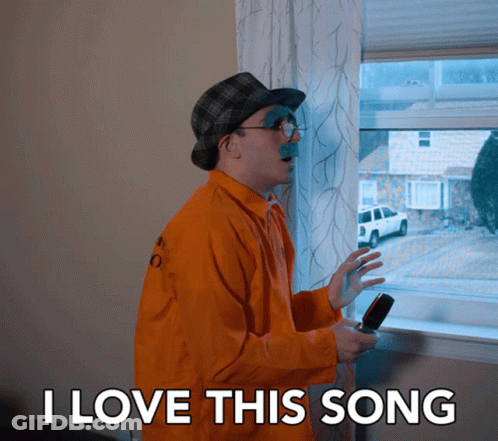 Man In Orange Jacket Saying I Love This Song GIF