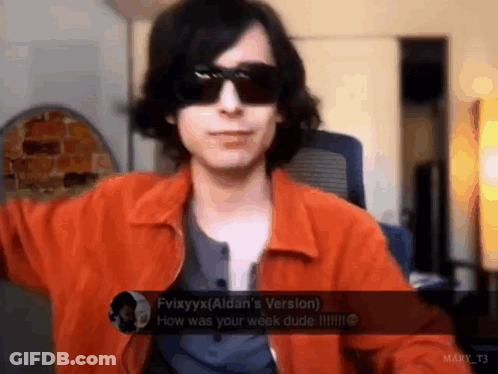 Man In Orange Jacket Talking GIF