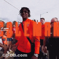 Man In Orange Jacket With Holland Text GIF
