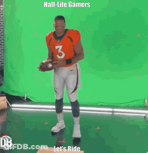 Man In Orange Jersey Holding Football GIF