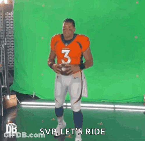 Man In Orange Jersey Holding Football GIF