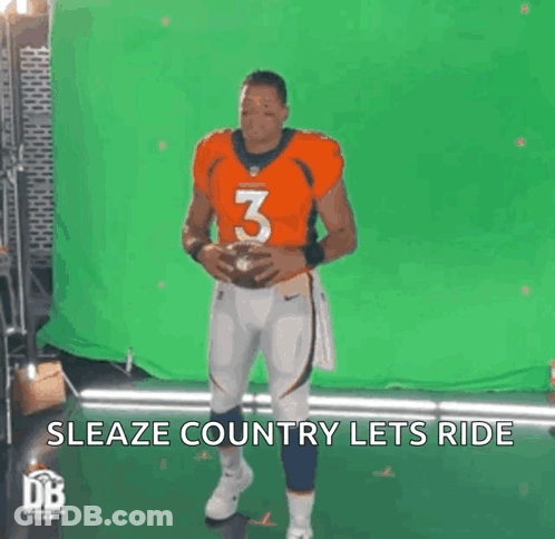 Man In Orange Jersey Number 3 Holding Football GIF