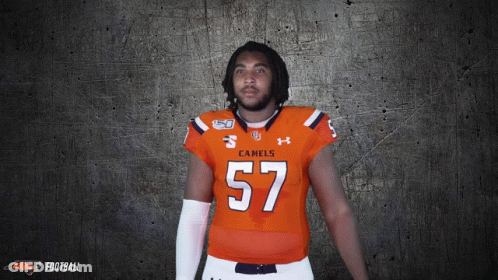 Man In Orange Jersey Number 57 GIF