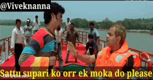 Man In Orange Life Vest Talks To Another Man In Boat GIF