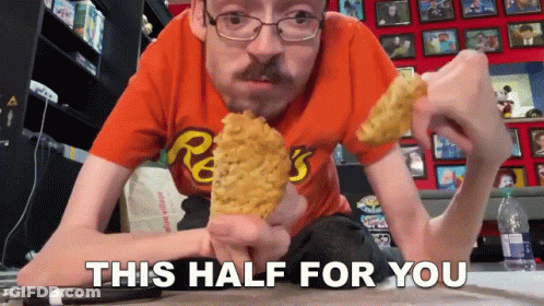 Man In Orange Reese's Shirt Eating Corn GIF