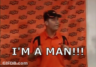 Man In Orange Shirt And Hat Saying I'm A Man GIF