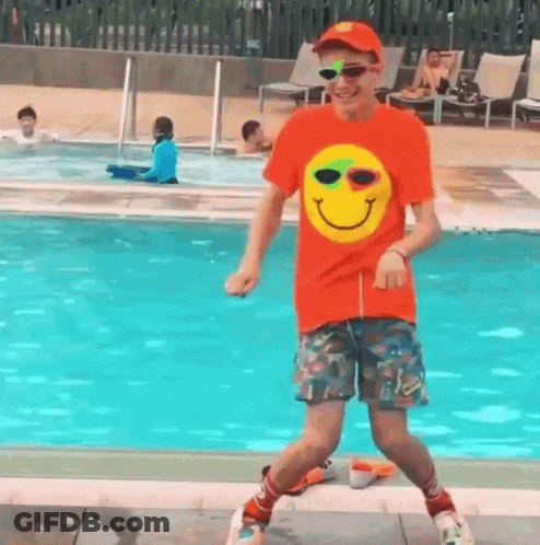 Man In Orange Shirt Dancing Near Pool GIF