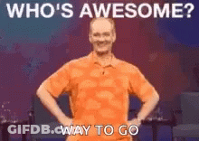 Man In Orange Shirt Hands On Hips Says Who's Awesome Way To Go GIF